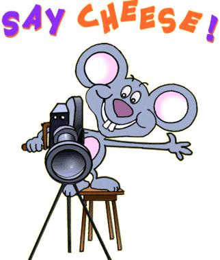Mouse saying "Say Cheese" with a camera. 