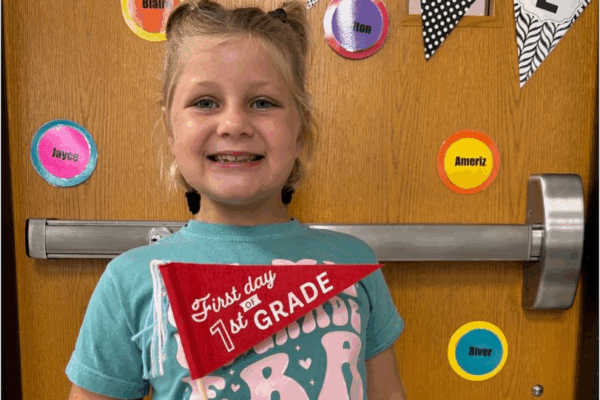 Picture of a student on the first day of first grade.